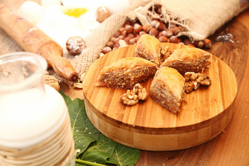 Baklava with ingredients on the wooden table