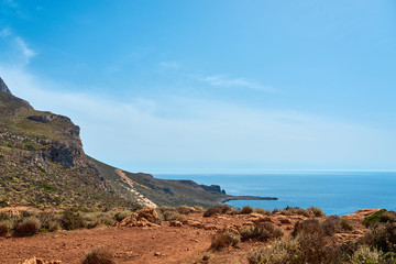 Sea coast in Kissamos Crete, Greece with blue sea, clear sky and horizon on a background. Copy space.
