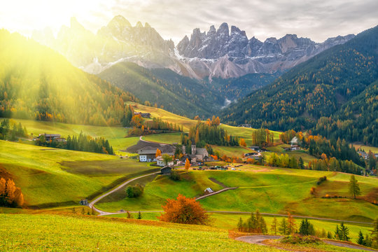 Colorful autumn scenery in Santa Maddalena village at sunrise. Dolomite Alps, South Tyrol, Italy.