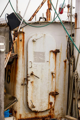 Hatch to rusting wheelhouse on aging fishing boat in Fairhaven © Vinoverde