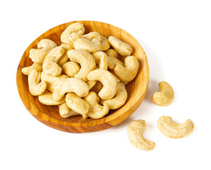 cashew nuts in a bowl isolated on white background