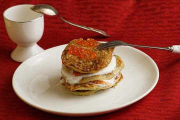 zucchini fritters and red caviar