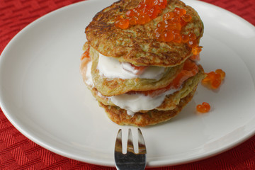 zucchini fritters and red caviar