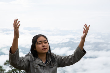 Happy teens deep breath fresh air on top mountain breathing clean air