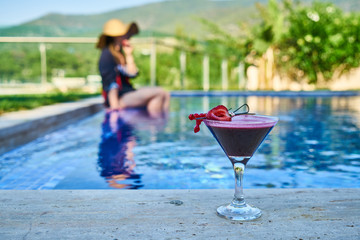 alcoholic cocktail by the pool