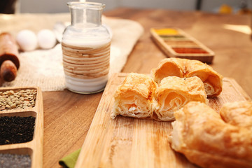 Patty serving with milk on the wooden table