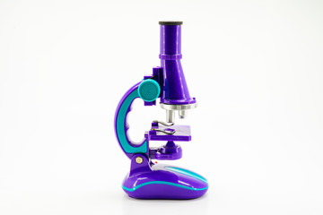 Purple microscope isolated on white.