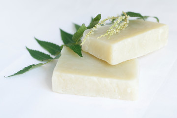 Natural bath soap for skin care on a white background, soft focus.