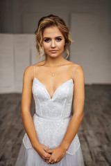 Fototapeta premium bride in beautiful dress in white Studio