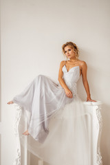Fototapeta na wymiar bride in beautiful dress in white Studio