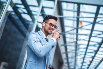 Handsome businessman enjoying coffee