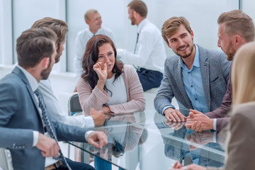 confident business woman explaining something to her business partners