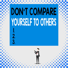 Handwriting text Don T Compare Yourself To Others. Conceptual photo Be your own version unique original Isolated view young man standing pointing upwards two hands big rectangle