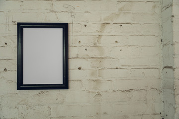 Blank picture hanging on a wall