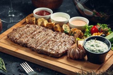 Fried steak with oven potatoes