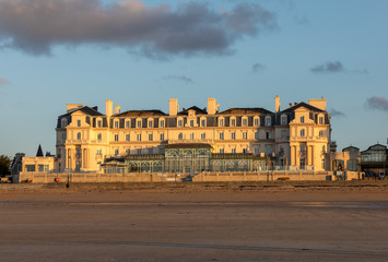 Fototapeta na wymiar The Thermes Marins Spa is in a stunning location on the beachfront and overlooks a fine sandy beach in St Malo. France
