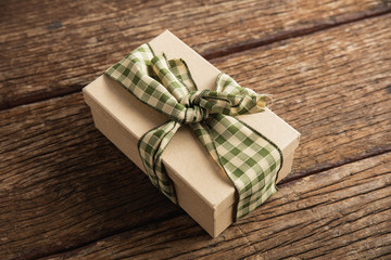 Simple wrapped gift on wooden table