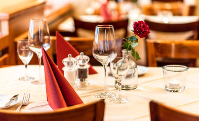 Wine glasses on a served table. A restaurant