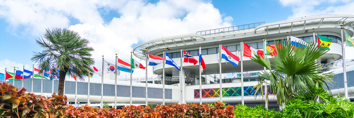 Miami airport building with flags of different countries