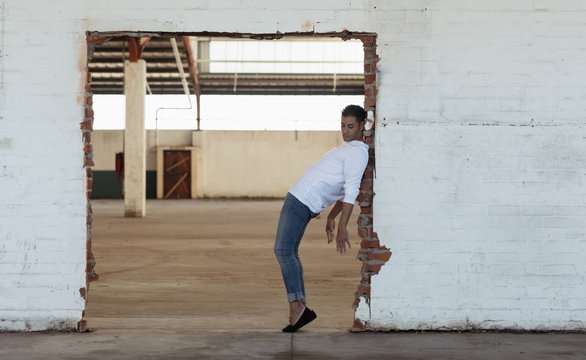 Male dancer in an empty warehouse