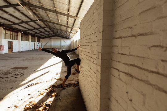 Male dancer in an empty warehouse