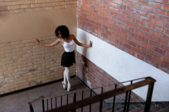 Female dancer in an empty warehouse
