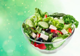 Closeup of Greek salad with feta cheese, cherry tomatoes and lettuce