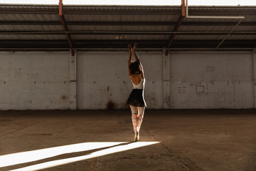 Female dancer in an empty warehouse