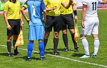 Soccer players and referees before match