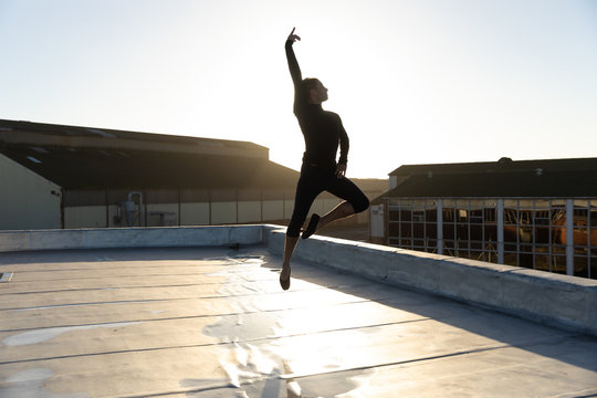 Female dancer on a rooftop