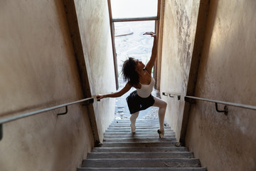 Female dancer in an empty warehouse