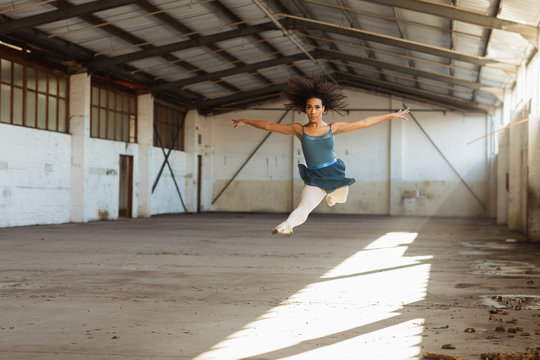 Female dancer in an empty warehouse