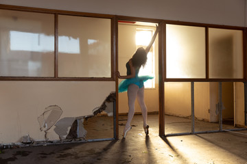 Female dancer in an empty warehouse