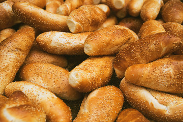Fototapeta na wymiar Fresh baked bread at the market closeup. Food background concept