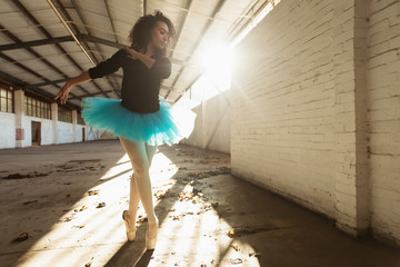 Female dancer in an empty warehouse