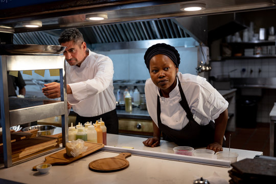 Chef checking orders in restaurant