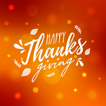 Stylish text of Happy Thanksgiving with leaves on orange bokeh effect background. Can be used as poster or greeting card design.