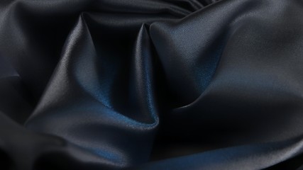 Draped dark grey satin fabric, background