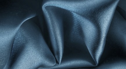 Draped satin fabric, blue color , background