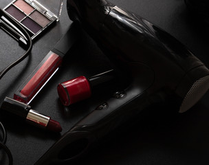 Various cosmetics  and beauty products on a black background. Close up photo.
