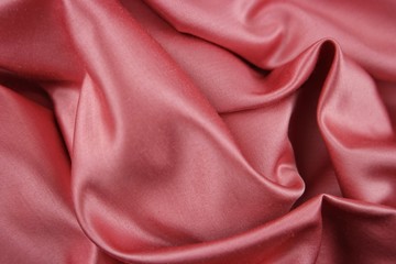 Draped pink satin fabric, background