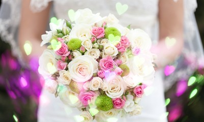 Bride with beautiful wedding bouquet on background