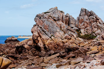 Bretonic Coast and Beach with Granite Rocks at the Cote de Granit Rose - Pink Granite Coast