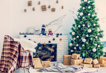 Fireplace and Christmas tree with presents in living room