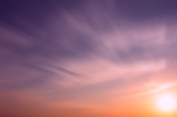 Fototapeta premium Beautiful sky at sunset, cirrus clouds and bright sun.