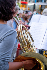 Cropped image of a back turned horn player