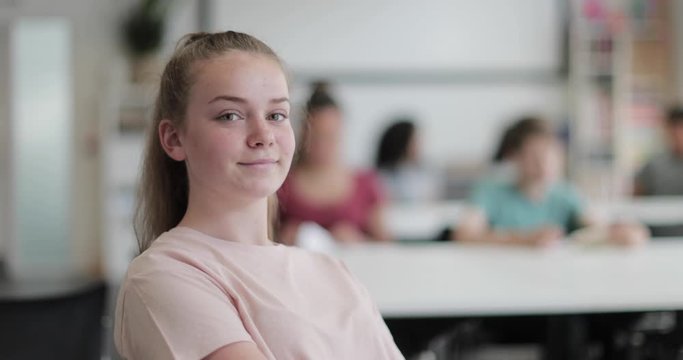 Portrait of female high school student in class