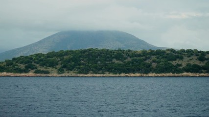 Mountain top in the cloud. Beautiful view of the greek island with rock in the Ionian sea. Nature of Greece. 4K