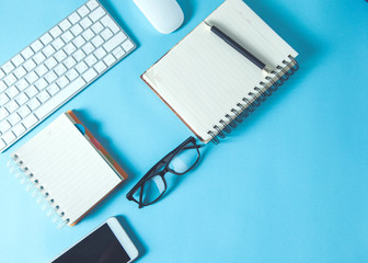 computer with notepads on desk