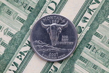 Symmetric composition of US dollar bills and a quarter of Montana